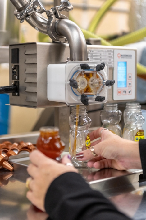 honey containers being filled